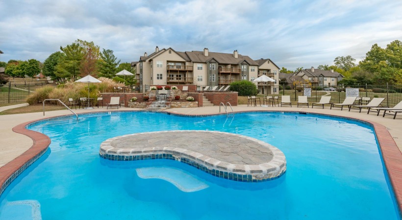 a swimming pool in front of a house