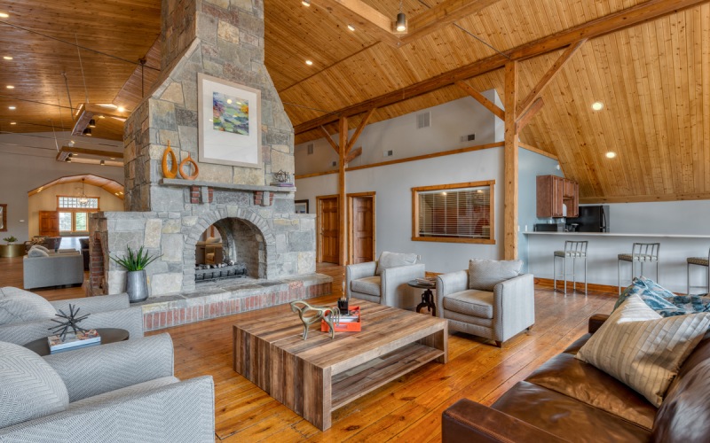 Apartment clubhouse with wood ceilings and a stone fireplace
